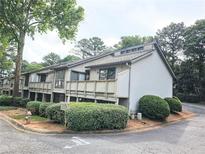 Townhome featuring multi-level decks, tidy landscaping, and painted exteriors at 5025 Highland Club Dr, Marietta, GA 30068