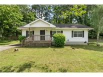 Charming single-story home with a front porch and well-maintained lawn at 354 Henry Aaron Sw Ave, Atlanta, GA 30310