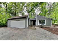 Charming one-story home with a two-car garage and mature trees at 2041 Kramer Way, Marietta, GA 30062