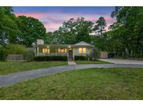 Charming single-story home featuring a welcoming front porch and well-maintained lawn at 502 Allen Dr, Lawrenceville, GA 30043