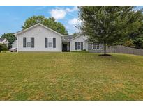 Charming single-story home with light siding, dark shutters, and a well-manicured lawn at 507 Hillcrest Cross Rd, Canton, GA 30115