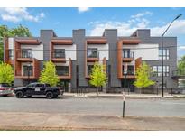 Modern townhome exterior featuring striking architecture, balconies, and professional landscaping at 367 Parkway Ne Dr # 5, Atlanta, GA 30312