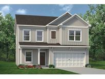 Charming two-story home with a two-car garage and a covered front porch at 383 Morgan Rd, Carrollton, GA 30116