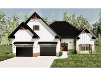Charming new construction with a two-car garage, sleek black doors and accents, and a beautifully landscaped lawn at 4850 Wynship Ln, Snellville, GA 30039