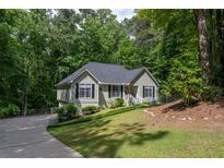Charming single-Gathering home with manicured lawn and mature trees, offering a peaceful setting at 1737 Mount Berry Dr, Douglasville, GA 30135
