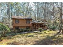 Charming two-story home with a welcoming front porch and a well-maintained, spacious front yard at 170 Beatrice St, Dallas, GA 30157