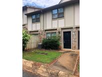 Charming townhome with stone accents and a well-manicured front yard at 1151 Rankin St # 21A, Stone Mountain, GA 30083