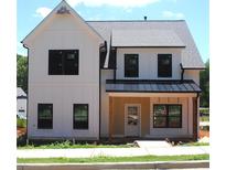 Charming two-story home featuring a modern farmhouse design and a welcoming front porch at 137 Old Alabama Rd, Emerson, GA 30137