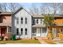 Charming two-story home with a well-maintained lawn, covered front porch, and neutral-toned exterior at 846 Brandy Oaks Ln, Stone Mountain, GA 30088