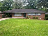 Charming one-story brick home with blue shutters and a well-maintained front yard at 2261 Star Mist Sw Dr, Atlanta, GA 30311