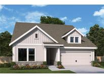 Charming single-story home with a two-car garage, complemented by lush landscaping and beautiful flowerbeds at 1049 Pine Bark Lane, Canton, GA 30114
