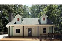 Charming home features a front porch, dormer windows and a new roof at 5345 Pilgrim Point Rd, Cumming, GA 30041