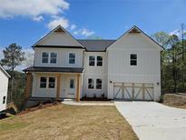 Charming two-story home with a well-manicured lawn and a classic white exterior at 195 Silvercrest Dr, Acworth, GA 30101