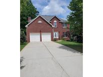 Charming two-story brick home with a well-manicured lawn and a two-car garage at 4217 Mill Grove Sw Ln, Smyrna, GA 30082