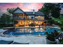 Outdoor oasis featuring a stunning pool and patio, perfect for relaxation and entertaining near the home at 1556 Gaylor Se Dr, Smyrna, GA 30082