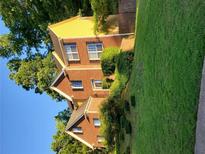 Beautiful two-story brick home with manicured lawn, mature trees, and symmetrical window placement at 3119 Grant Way, East Point, GA 30344