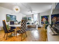 Inviting living room featuring a zebra rug, modern lighting, and an open floor plan perfect for entertaining at 130 26Th Nw St # 701, Atlanta, GA 30309
