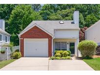 Charming home with a brick facade, attached garage, and well-maintained landscaping at 2507 Albion Farm Way, Duluth, GA 30097