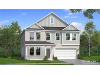 Charming two-story home with brick and gray siding, a well-manicured lawn, and a two-car garage at 2485 Dixon Pl, Lawrenceville, GA 30045