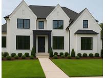 Stunning two-story home featuring a brick exterior, black trim, lush green lawn, and manicured landscaping at 2868 Octavia Cir, Marietta, GA 30062