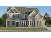 Stunning two-story home boasts a brick facade and charming shutters at 255 Deer Valley Run, Canton, GA 30115