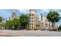 Exterior shot of condo in the city with street view and landscaping at 390 17Th Nw St # 2040, Atlanta, GA 30363