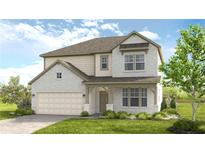 Charming two-story home features a brick and siding exterior, attached two-car garage, and manicured lawn at 1734 Fawlocke Run, Loganville, GA 30052
