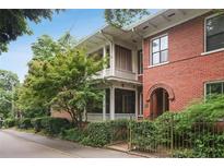 Charming brick home featuring a double porch and manicured landscaping, offering classic elegance at 205 3Rd Street Northeast Ne St # 4, Atlanta, GA 30308