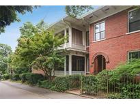 Charming brick home with inviting covered porch and meticulously maintained landscaping at 205 3Rd Street Northeast Ne St # 4, Atlanta, GA 30308