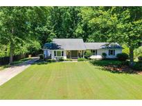 Ranch home with large front yard and mature trees offering plenty of shade at 290 Dania Dr, Alpharetta, GA 30009
