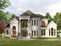 Stunning two-story home with lush landscaping, large windows, and elegant architectural details at 110 Serenity Pl, Fayetteville, GA 30214
