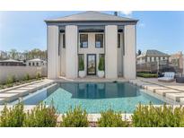 Stunning pool area with modern design and luxurious features, perfect for relaxation and entertainment at 245 Roycroft Ln, Fayetteville, GA 30214