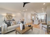 Bright living room featuring modern decor, comfortable seating, and an open floor plan at 3352 Cranston Ln, Kennesaw, GA 30144