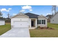 Charming single-story home featuring a manicured lawn, attached garage, and inviting front entrance at 1626 Palladian Way, Lithonia, GA 30058