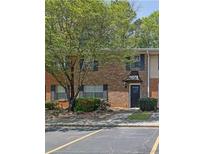 A charming brick townhouse featuring a quaint entrance and well-maintained landscaping at 191 Northdale Pl, Lawrenceville, GA 30046