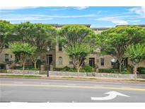 Charming townhomes line the street, adorned with mature trees and inviting entrances, creating a picturesque neighborhood setting at 1199 Lavista Ne Rd, Atlanta, GA 30324