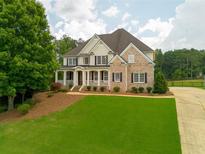 Charming two-story home featuring a welcoming porch and well-manicured lawn at 388 Golf Crest Dr, Acworth, GA 30101