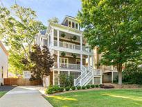 Inviting exterior view of a two-story home with double decks and a well-manicured lawn at 891 Paoli Se Ave, Atlanta, GA 30316