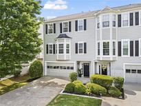 Charming townhouse with well-maintained landscaping and a two-car garage at 4044 Spring Cove Dr, Duluth, GA 30097