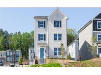 Charming two-story home with a combination of white brick and gray siding, complemented by a bright blue front door at 624 Devon Aly, Acworth, GA 30102