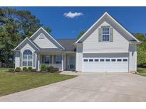 Charming two-story home with well-manicured lawn, attached garage, and inviting front porch at 2780 Matlin Way, Buford, GA 30519