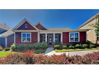 Charming single story home with a well manicured front yard and inviting front porch at 9866 Garden Hill Ln, Douglasville, GA 30135