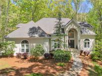 Charming home with a well-manicured lawn, beautiful landscaping, and a welcoming entrance at 3500 Lost Valley Dr, Jonesboro, GA 30236