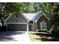 Charming home with stone accents, two-car garage, and well-maintained landscaping at 1245 Mclendon Dr, Decatur, GA 30033