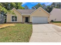 Charming single Gathering home with a well manicured lawn and a two car garage at 2601 Garland Way, Duluth, GA 30096