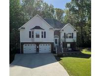 Charming two-story home with attached two-car garage, landscaped yard, and a traditional design at 40 Legend Creek, Douglasville, GA 30134
