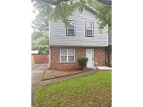 Charming two-story home with brick accents and a neatly manicured lawn at 3530 Hopkins Ct, Powder Springs, GA 30127