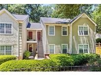 Inviting townhome with traditional architecture and landscaped front yard at 98 Hampshire Ct, Avondale Estates, GA 30002