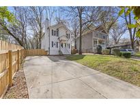 Charming two-story home with a spacious driveway and well-maintained lawn and neutral color scheme at 2453 Paul Nw Ave, Atlanta, GA 30318