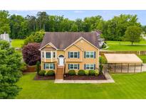 Charming two-story home with manicured lawn and ample parking at 638 Oberlochen Way, Douglasville, GA 30134